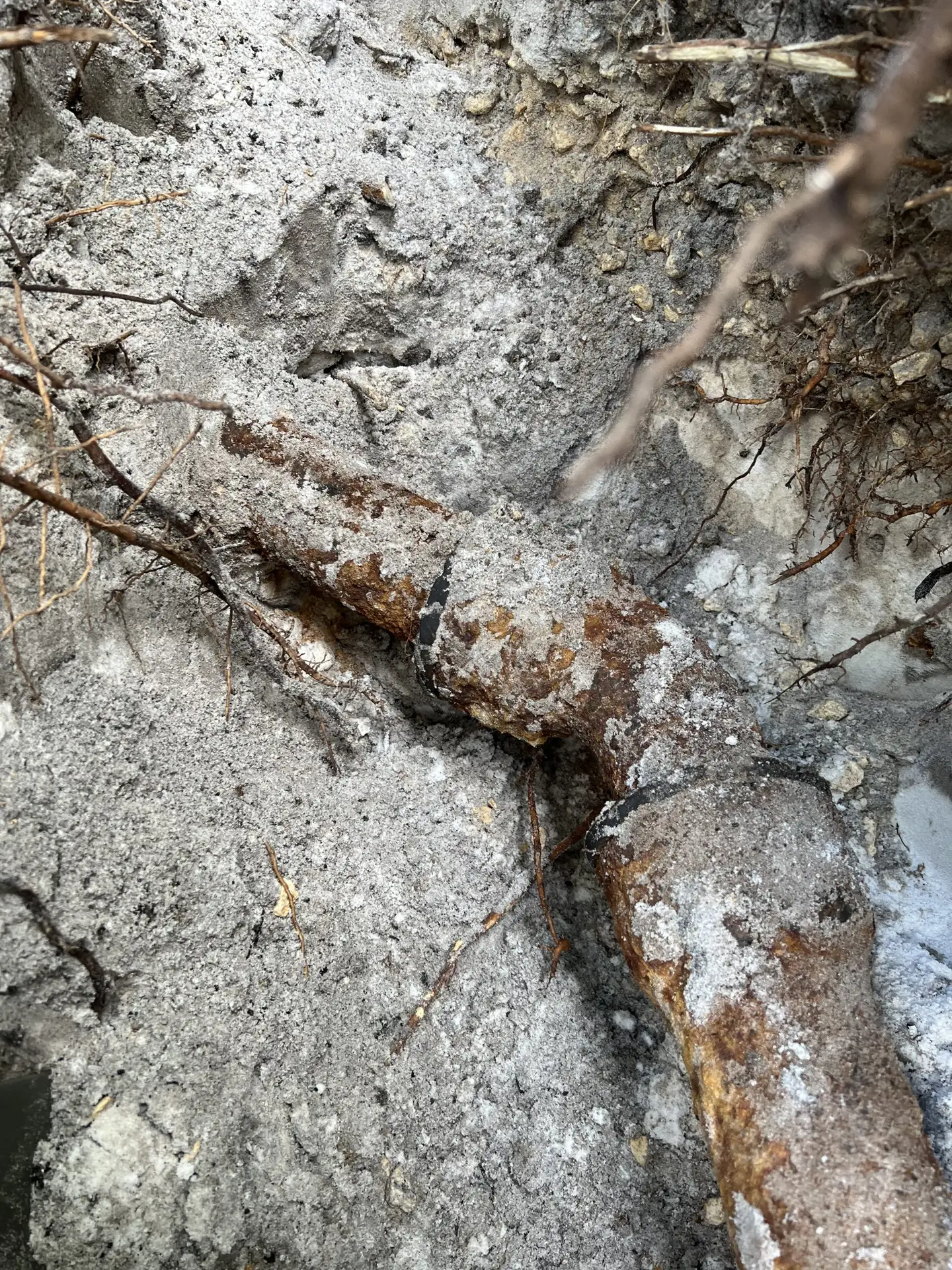 Collapsed cast iron sewer line excavation at an older South Florida home